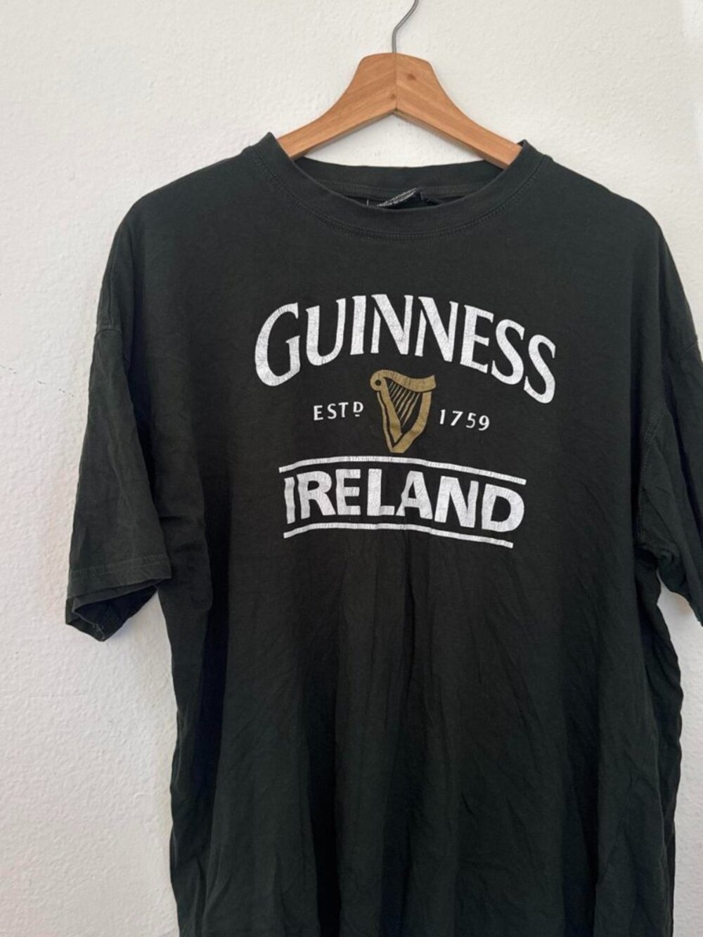 Guinness Ireland black t-shirt with white text and harp logo, size XL